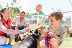 Family with new dog and dog essentials for walking